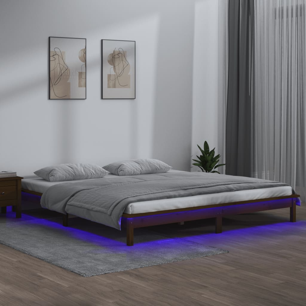 sengeramme med LED-lys 120x190 cm massivt træ gyldenbrun