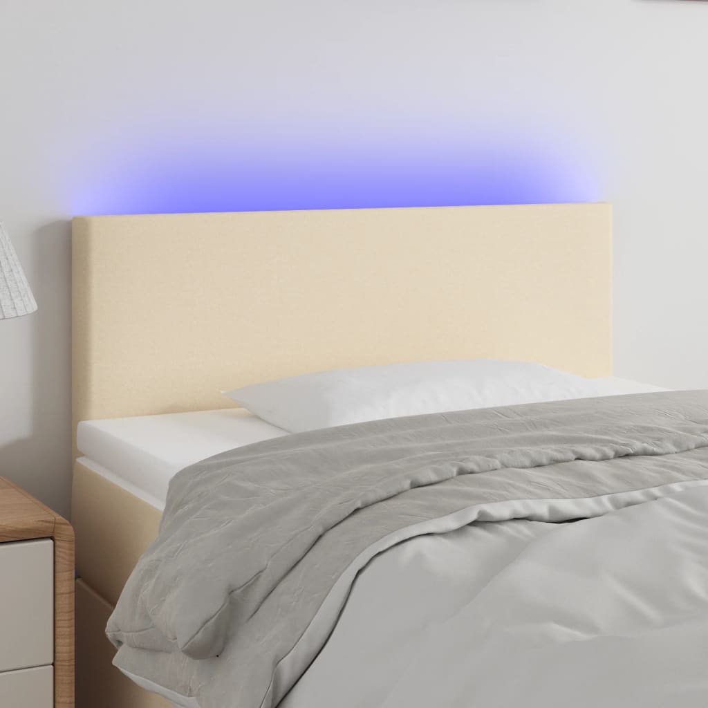 sengegavl med LED-lys 90x5x78/88 cm stof cremefarvet