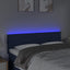 sengegavl med LED-lys 144x5x78/88 cm stof cremefarvet