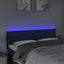 sengegavl med LED-lys 144x5x78/88 cm stof blå