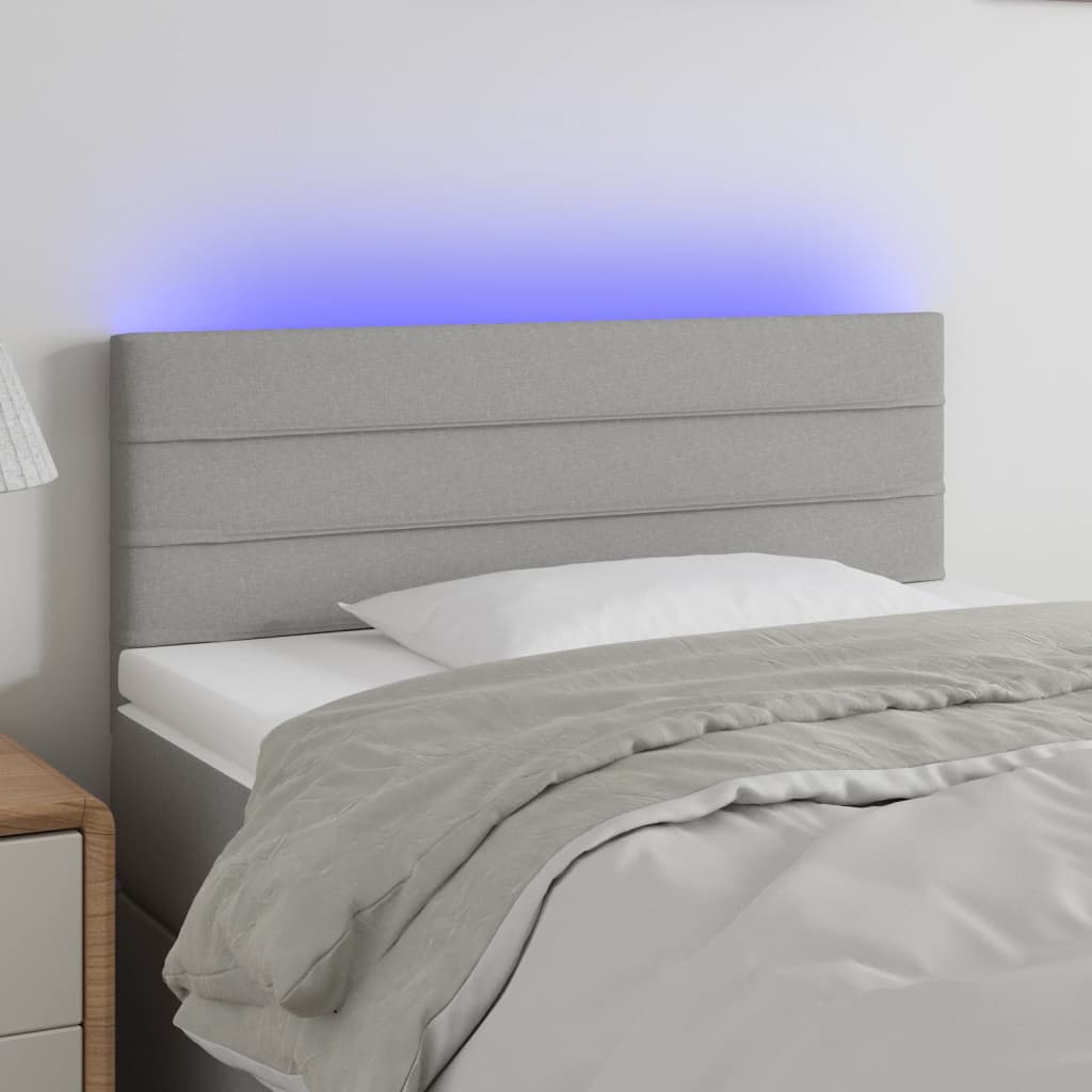 sengegavl med LED-lys 100x5x78/88 cm stof lysegrå