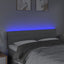 sengegavl med LED-lys 144x5x78/88 cm stof lysegrå