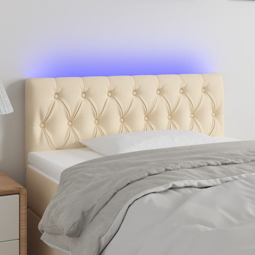 sengegavl med LED-lys 90x7x78/88 cm stof cremefarvet