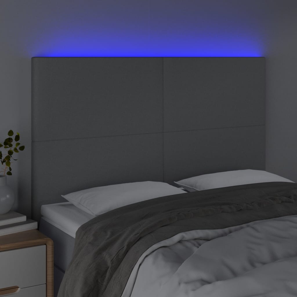 sengegavl med LED-lys 144x5x118/128 cm stof lysegrå
