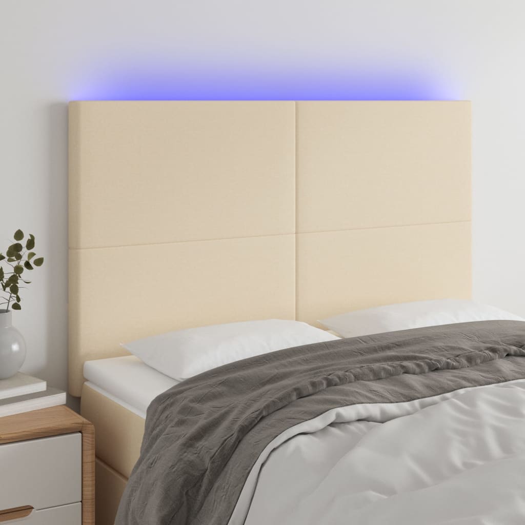 sengegavl med LED-lys 144x5x118/128 cm stof cremefarvet