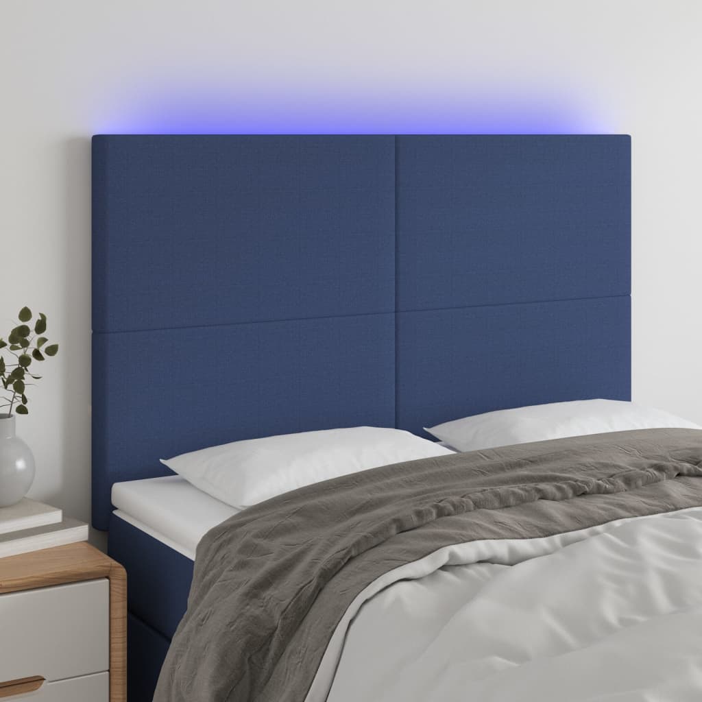 sengegavl med LED-lys 144x5x118/128 cm stof blå