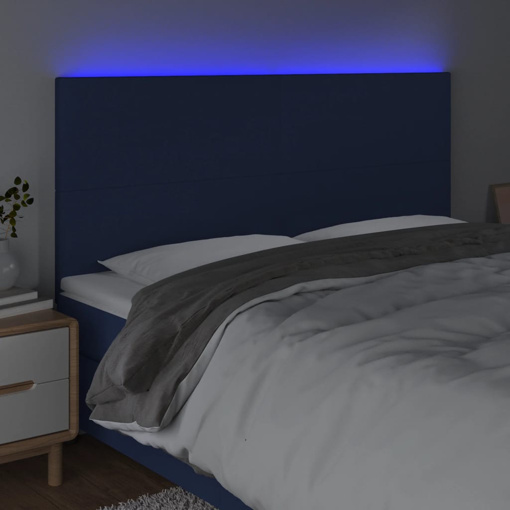 sengegavl med LED-lys 180x5x118/128 cm stof blå