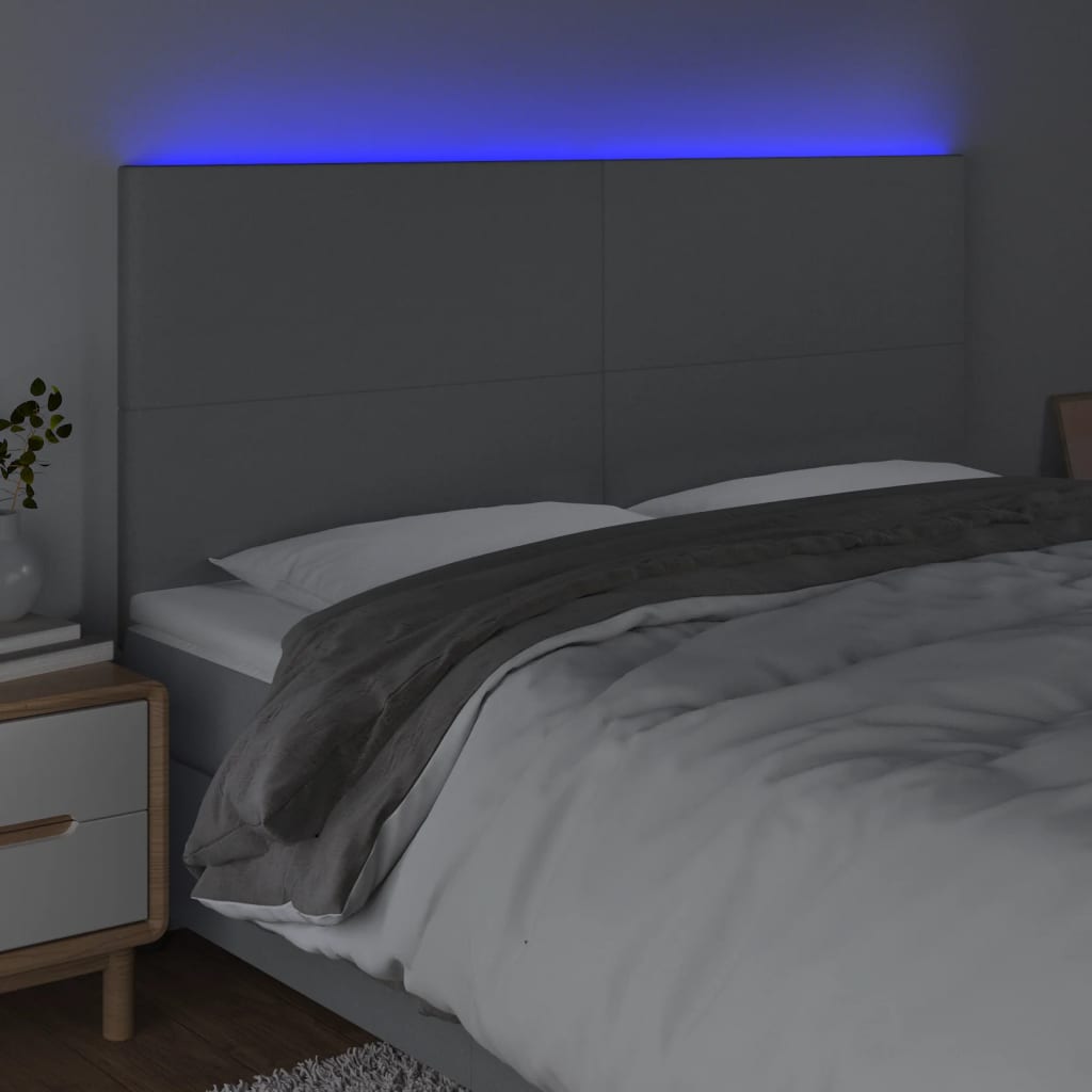 sengegavl med LED-lys 200x5x118/128 cm stof lysegrå