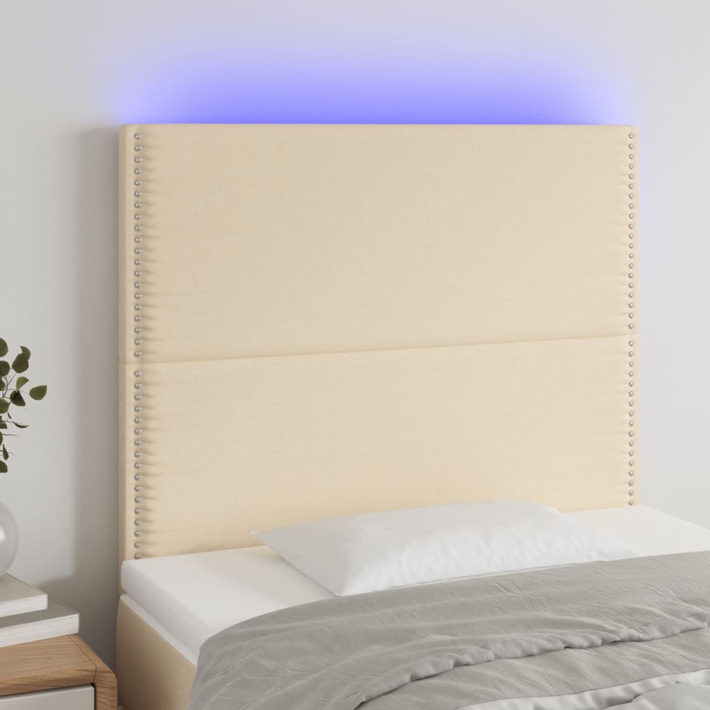 sengegavl med LED-lys 90x5x118/128 cm stof cremefarvet