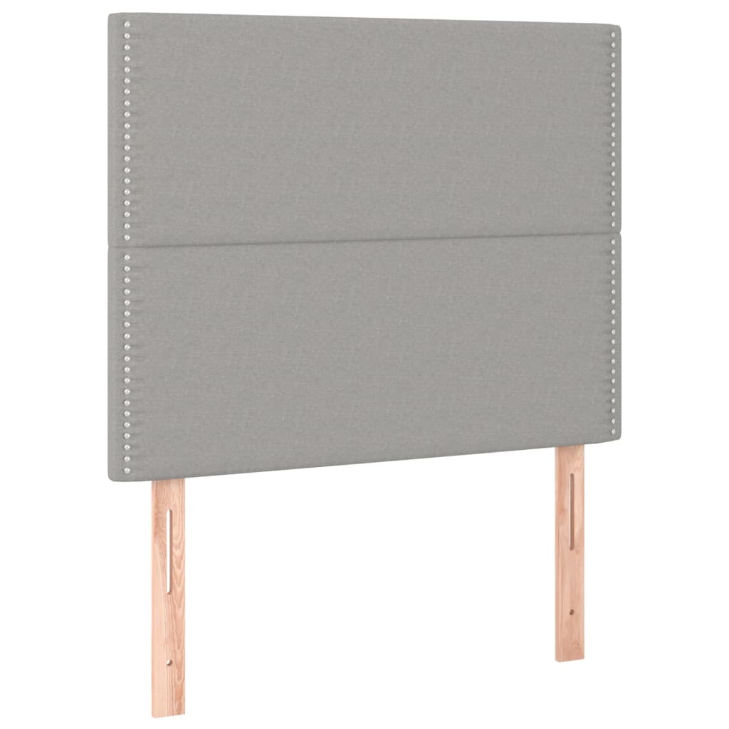 sengegavl med LED-lys 100x5x118/128 cm stof lysegrå