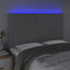 sengegavl med LED-lys 144x5x118/128 cm stof lysegrå