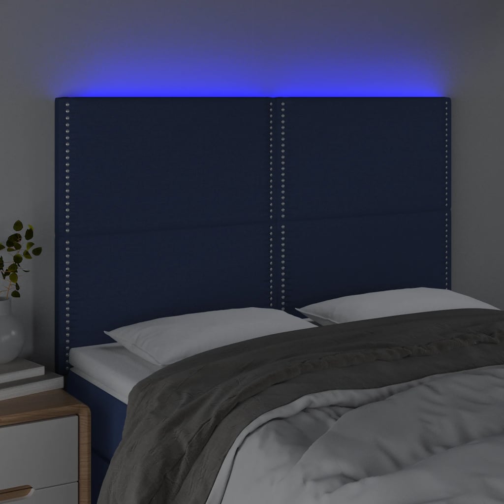 sengegavl med LED-lys 144x5x118/128 cm stof blå