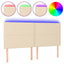 sengegavl med LED-lys 180x5x118/128 cm stof cremefarvet