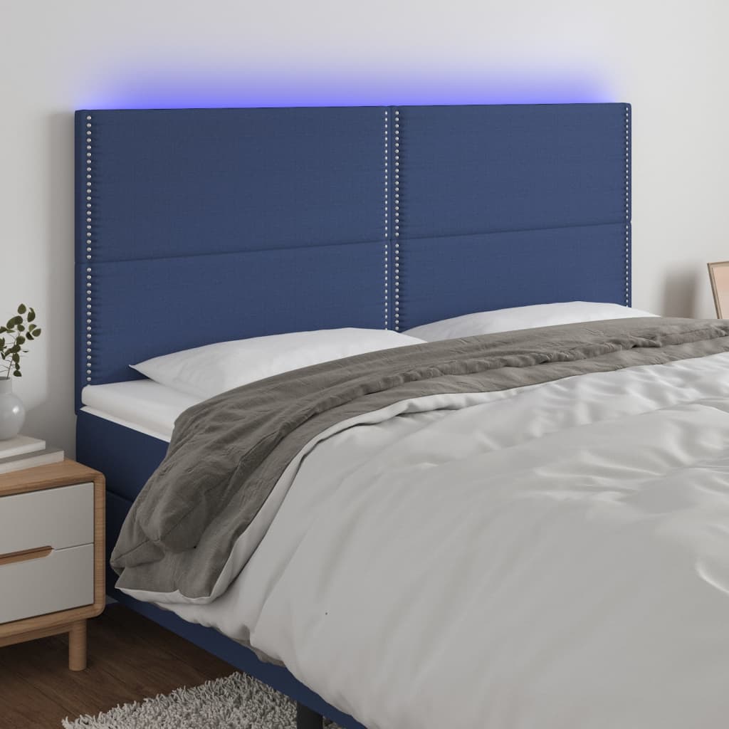 sengegavl med LED-lys 200x5x118/128 cm stof blå