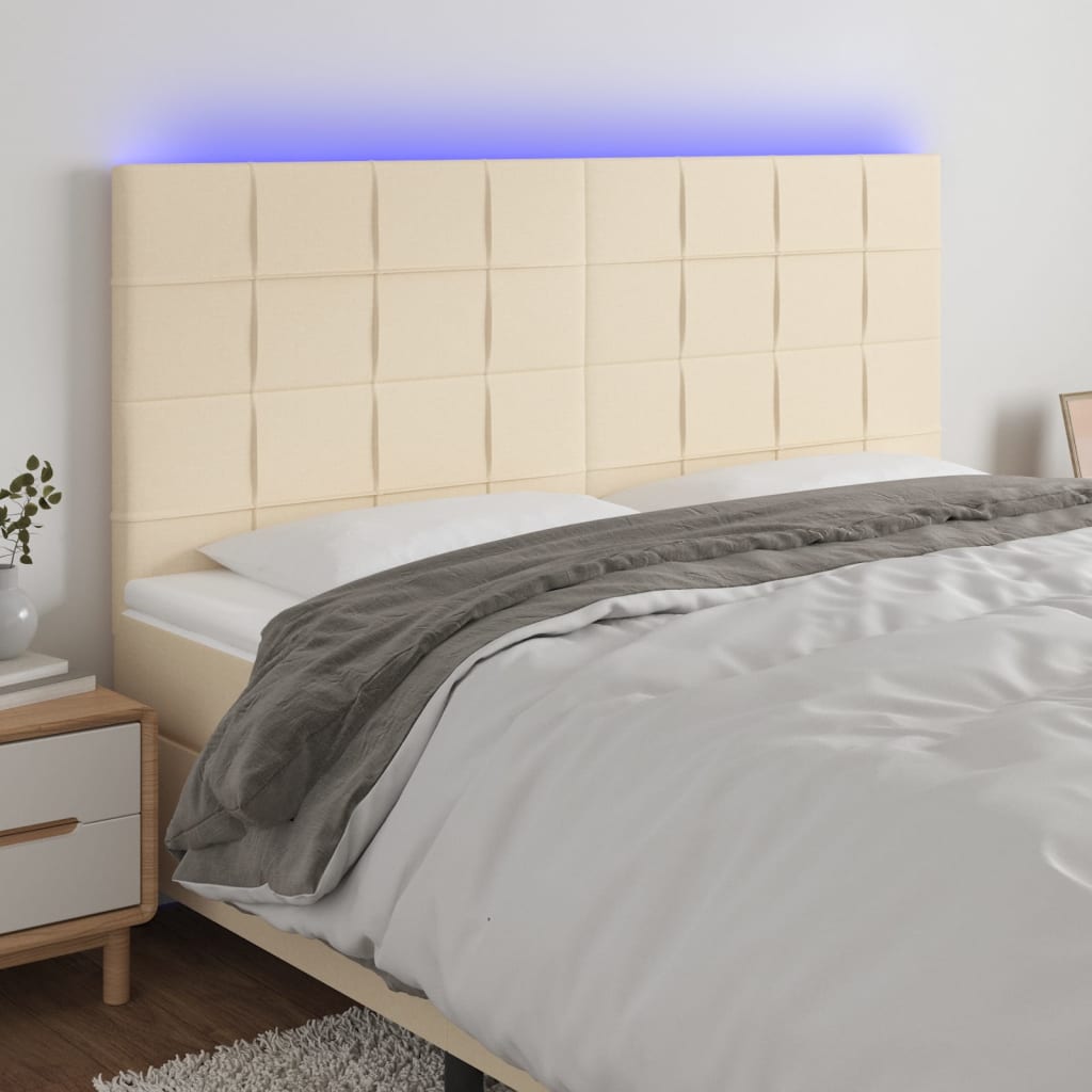 sengegavl med LED-lys 200x5x118/128 cm stof Cremefarvet