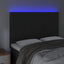 sengegavl med LED-lys 144x5x118/128 cm fløjl sort