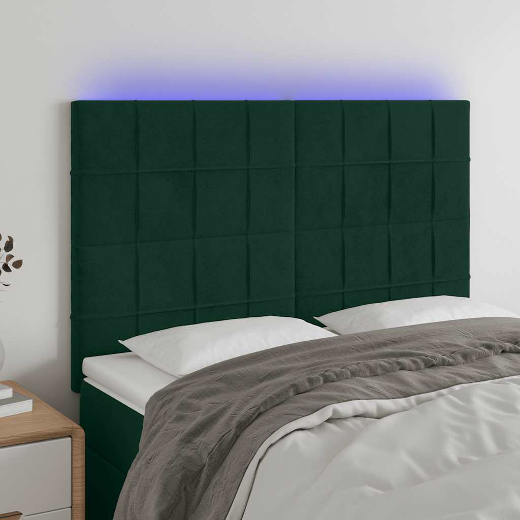 sengegavl med LED-lys 144x5x118/128 cm fløjl mørkegrøn
