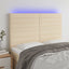 sengegavl med LED-lys 144x5x118/128 cm stof cremefarvet
