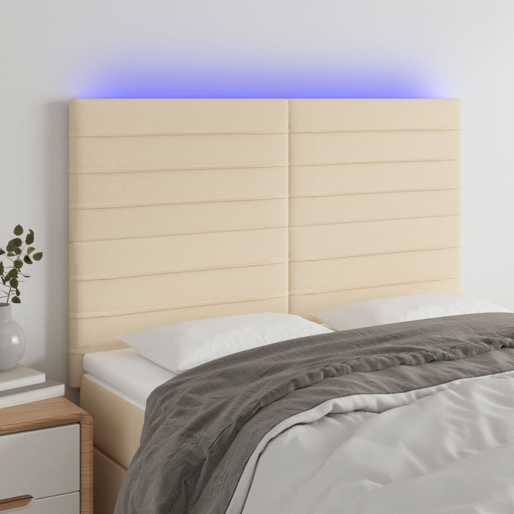 sengegavl med LED-lys 144x5x118/128 cm stof cremefarvet