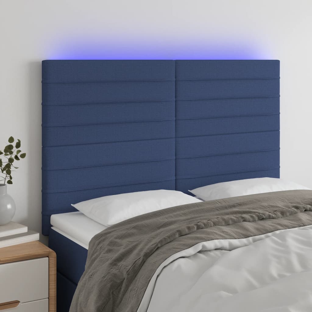 sengegavl med LED-lys 144x5x118/128 cm stof blå