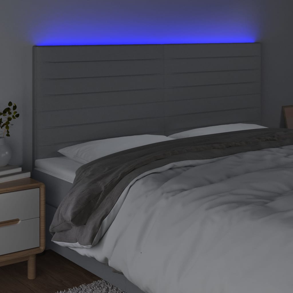 sengegavl med LED-lys 200x5x118/128 cm stof lysegrå
