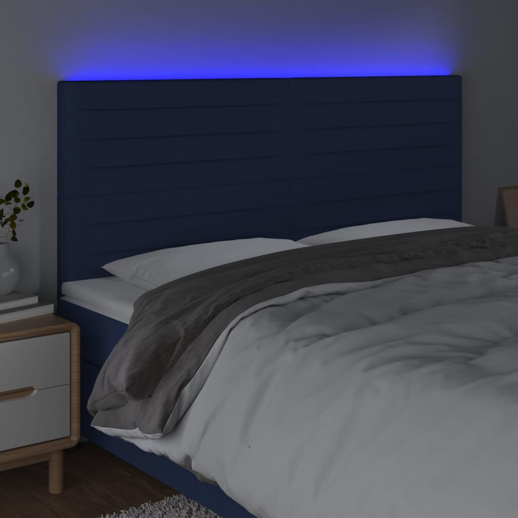 sengegavl med LED-lys 200x5x118/128 cm stof blå