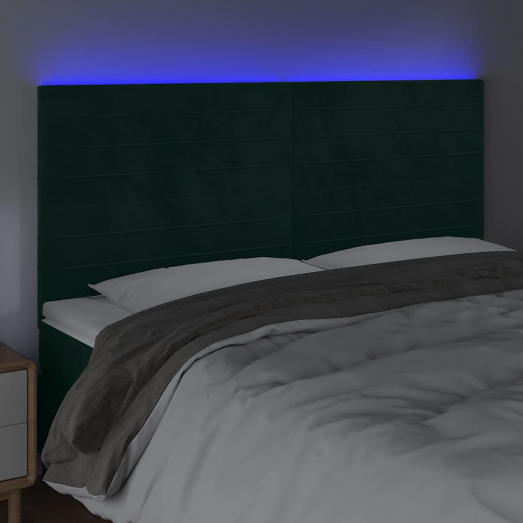 sengegavl med LED-lys 180x5x118/128 cm fløjl mørkegrøn