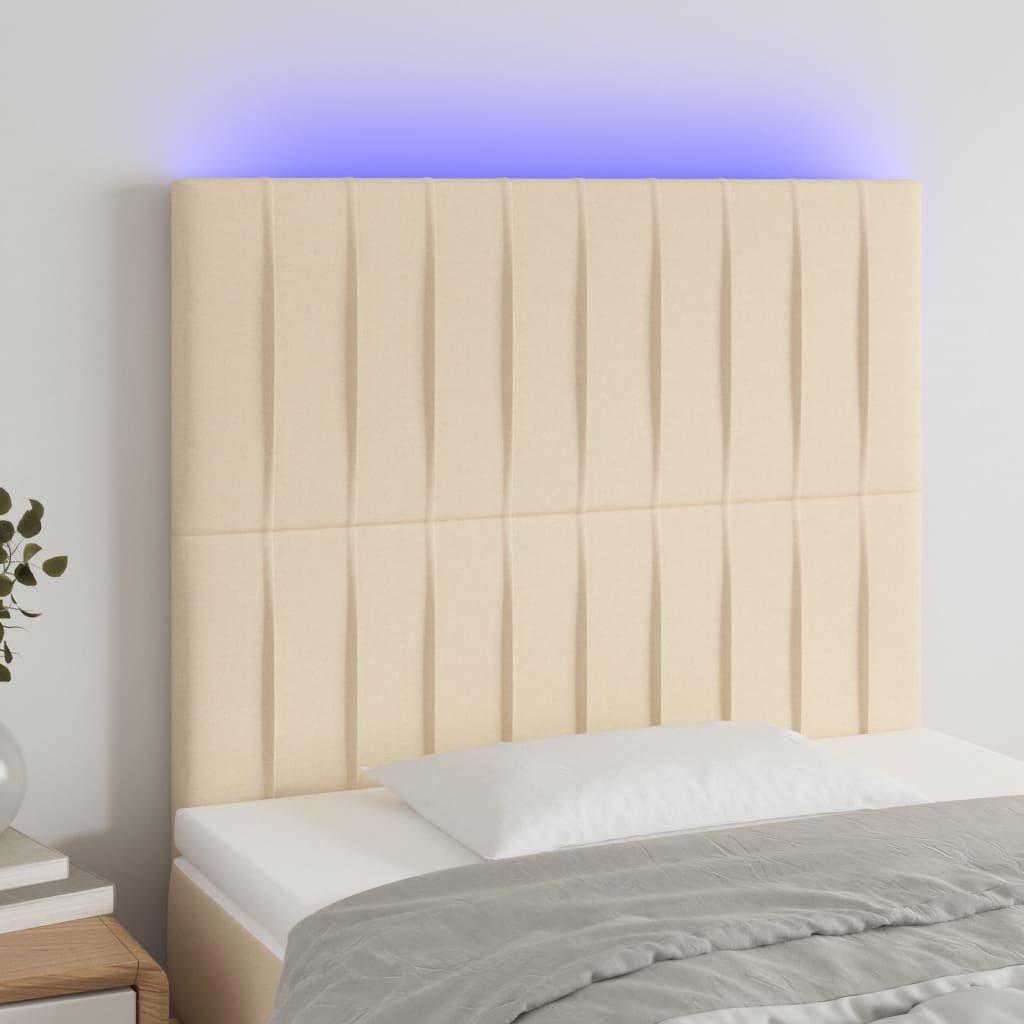 sengegavl med LED-lys 100x5x118/128 cm stof cremefarvet