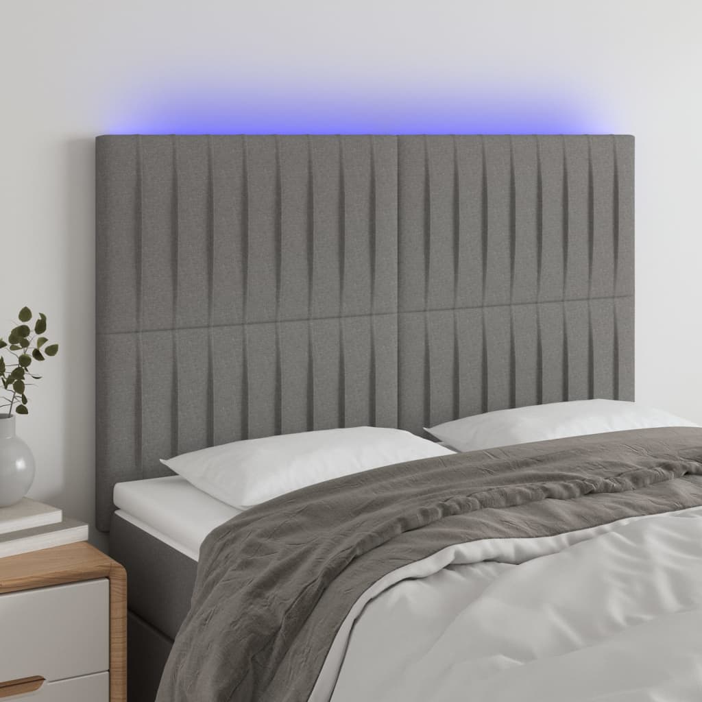 sengegavl med LED-lys 144x5x118/128 cm stof mørkegrå