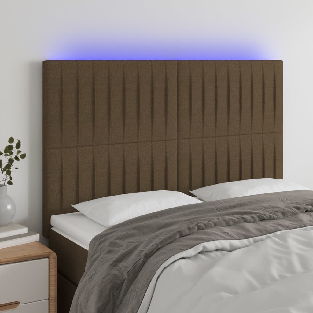 sengegavl med LED-lys 144x5x118/128 cm stof mørkebrun