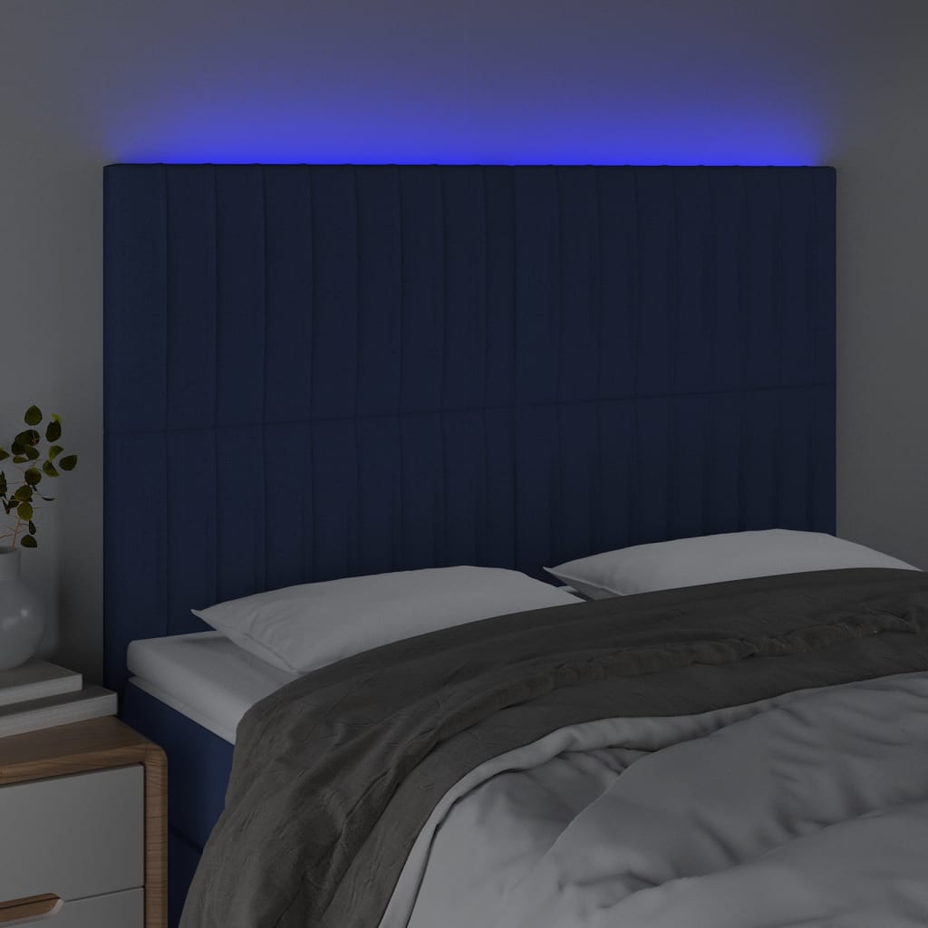 sengegavl med LED-lys 144x5x118/128 cm stof blå