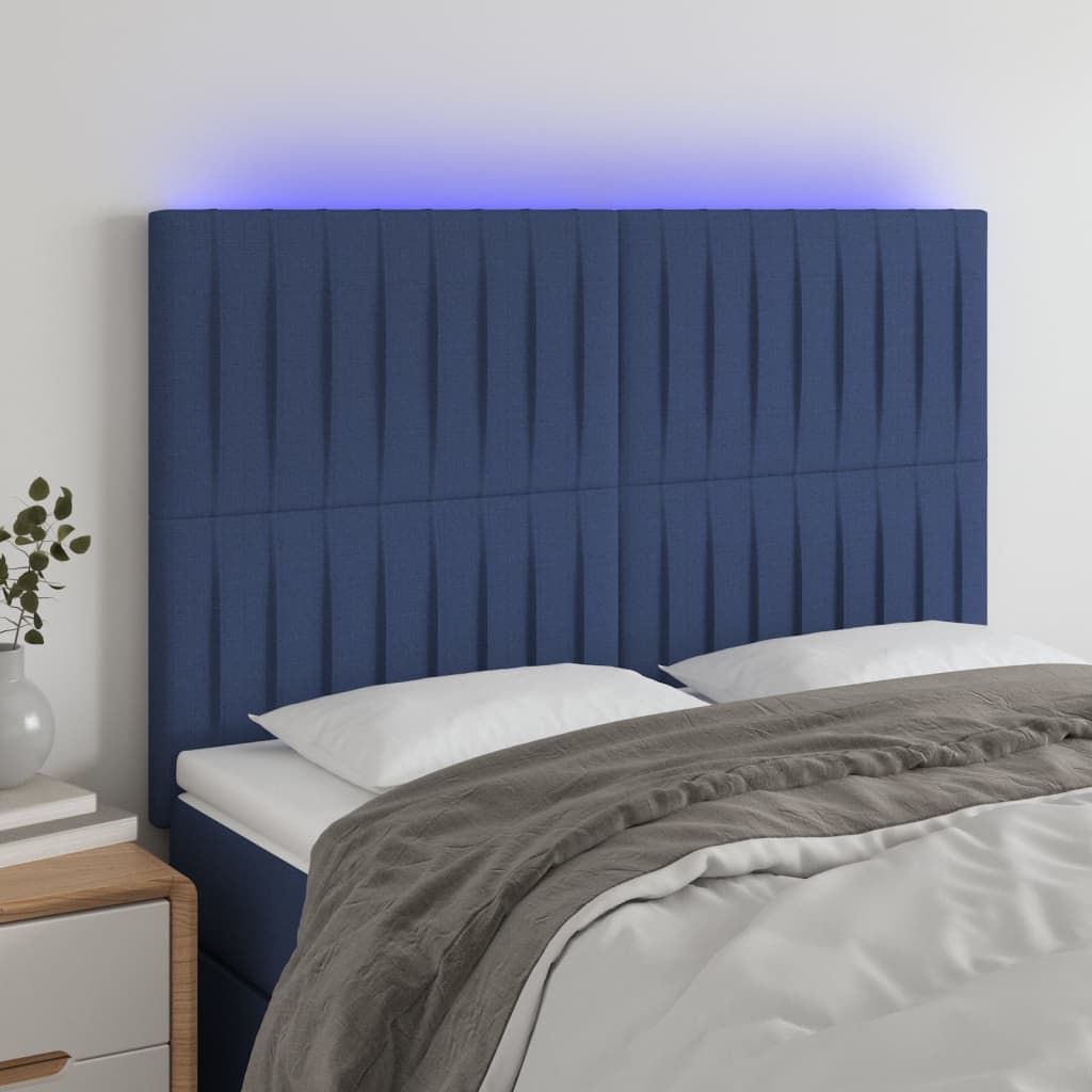 sengegavl med LED-lys 144x5x118/128 cm stof blå