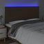 sengegavl med LED-lys 160x5x118/128 cm stof mørkebrun