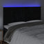 sengegavl med LED-lys 160x5x118/128 cm fløjl sort