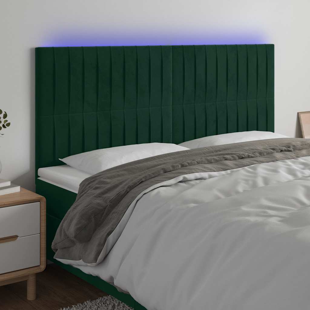 sengegavl med LED-lys 180x5x118/128 cm fløjl mørkegrøn