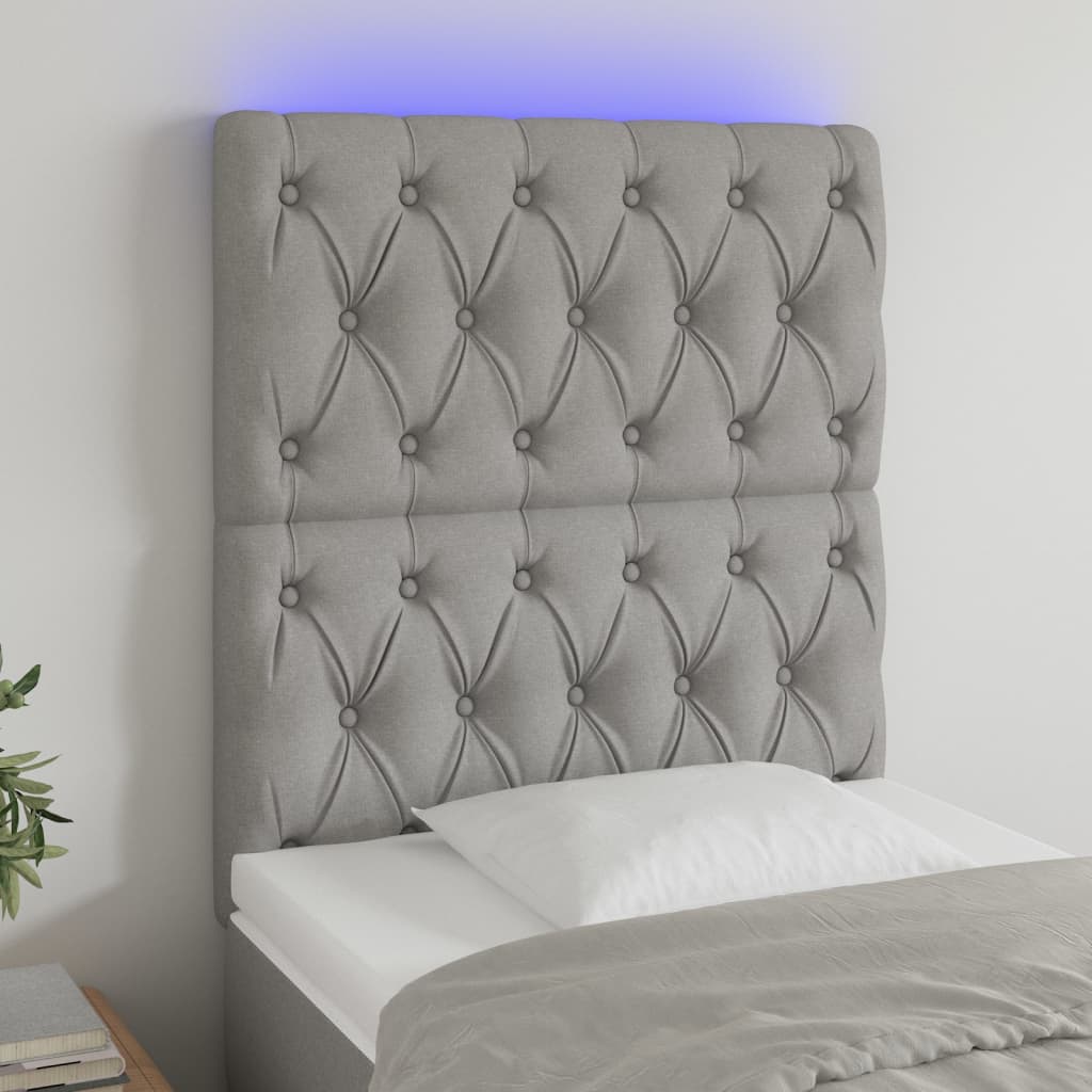 sengegavl med LED-lys 80x7x118/128 cm stof lysegrå