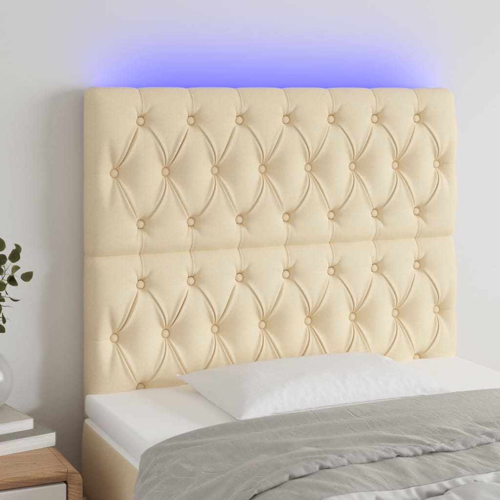 sengegavl med LED-lys 100x7x118/128 cm stof cremefarvet