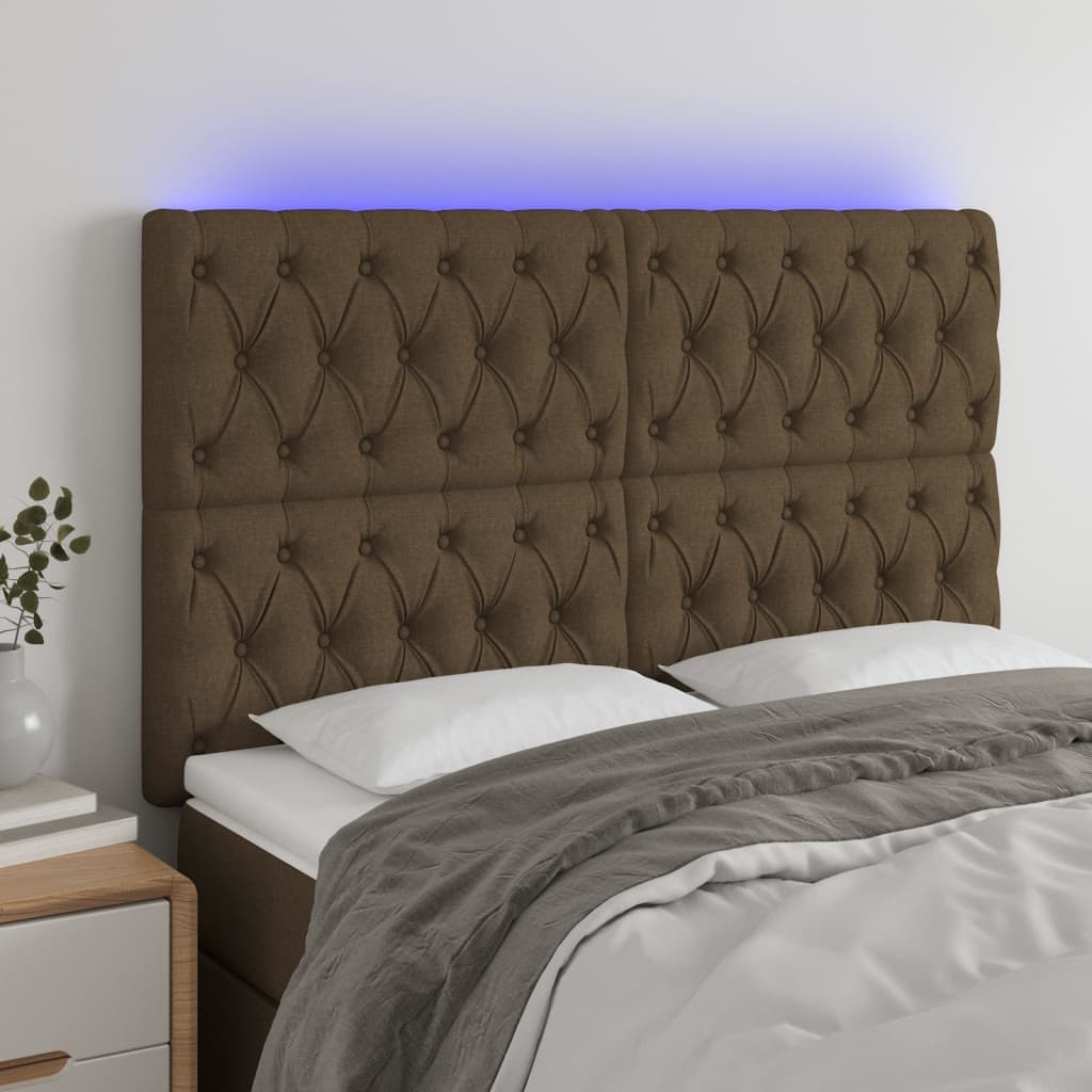 sengegavl med LED-lys 144x7x118/128 cm stof mørkebrun