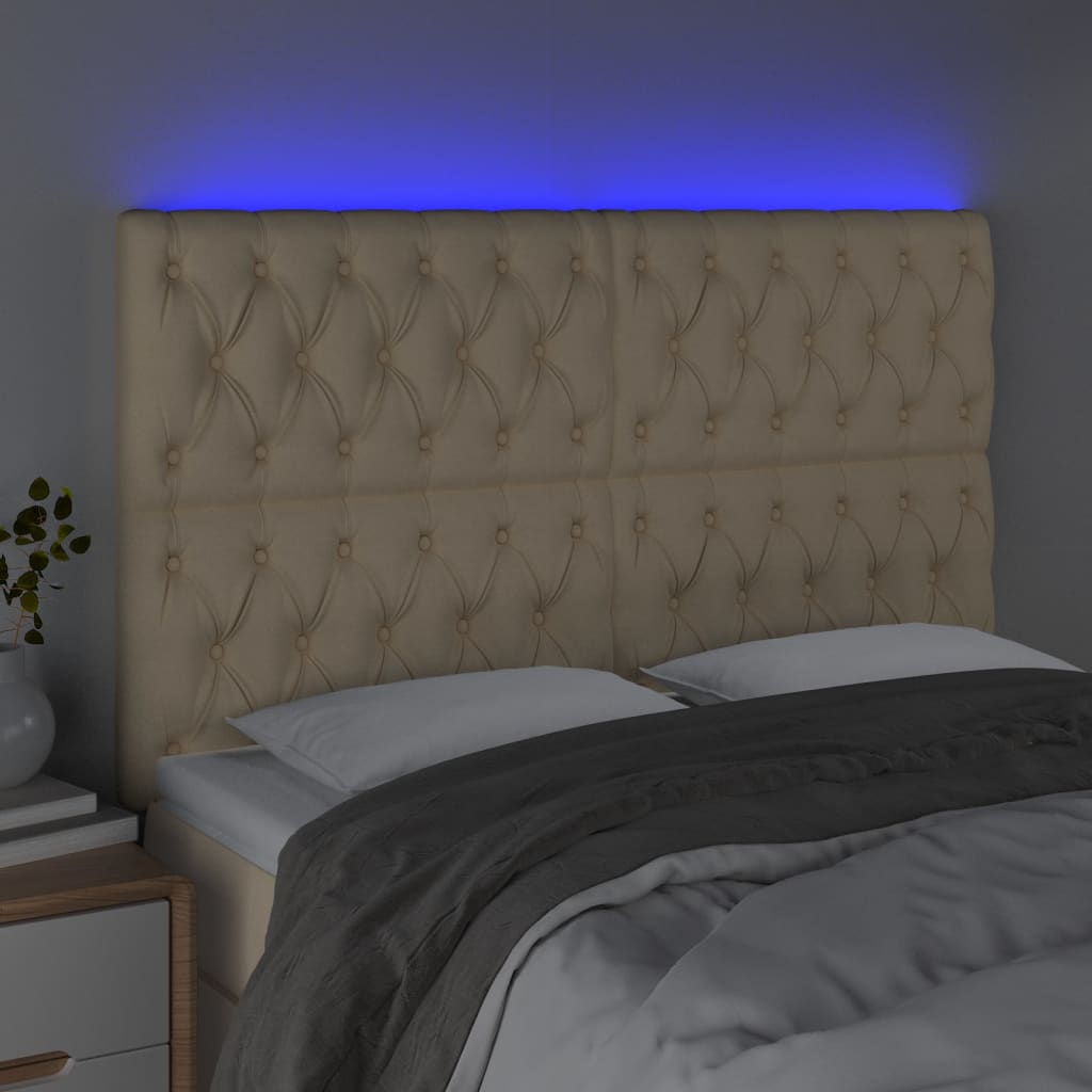 sengegavl med LED-lys 144x7x118/128 cm stof cremefarvet