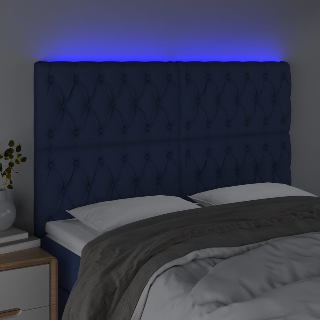 sengegavl med LED-lys 144x7x118/128 cm stof blå