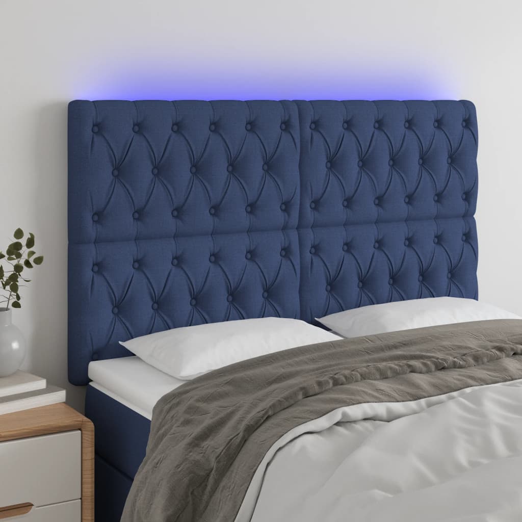 sengegavl med LED-lys 144x7x118/128 cm stof blå
