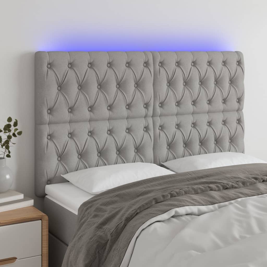 sengegavl med LED-lys 160x7x118/128 cm stof lysegrå
