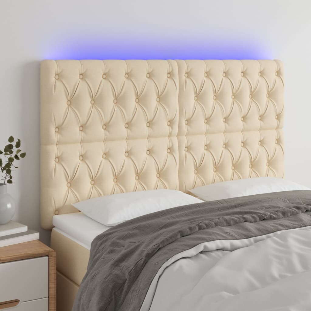 sengegavl med LED-lys 160x7x118/128 cm stof cremefarvet