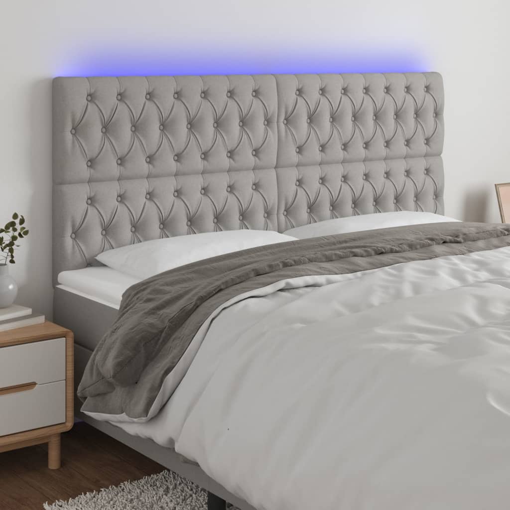 sengegavl med LED-lys 180x7x118/128 cm stof lysegrå