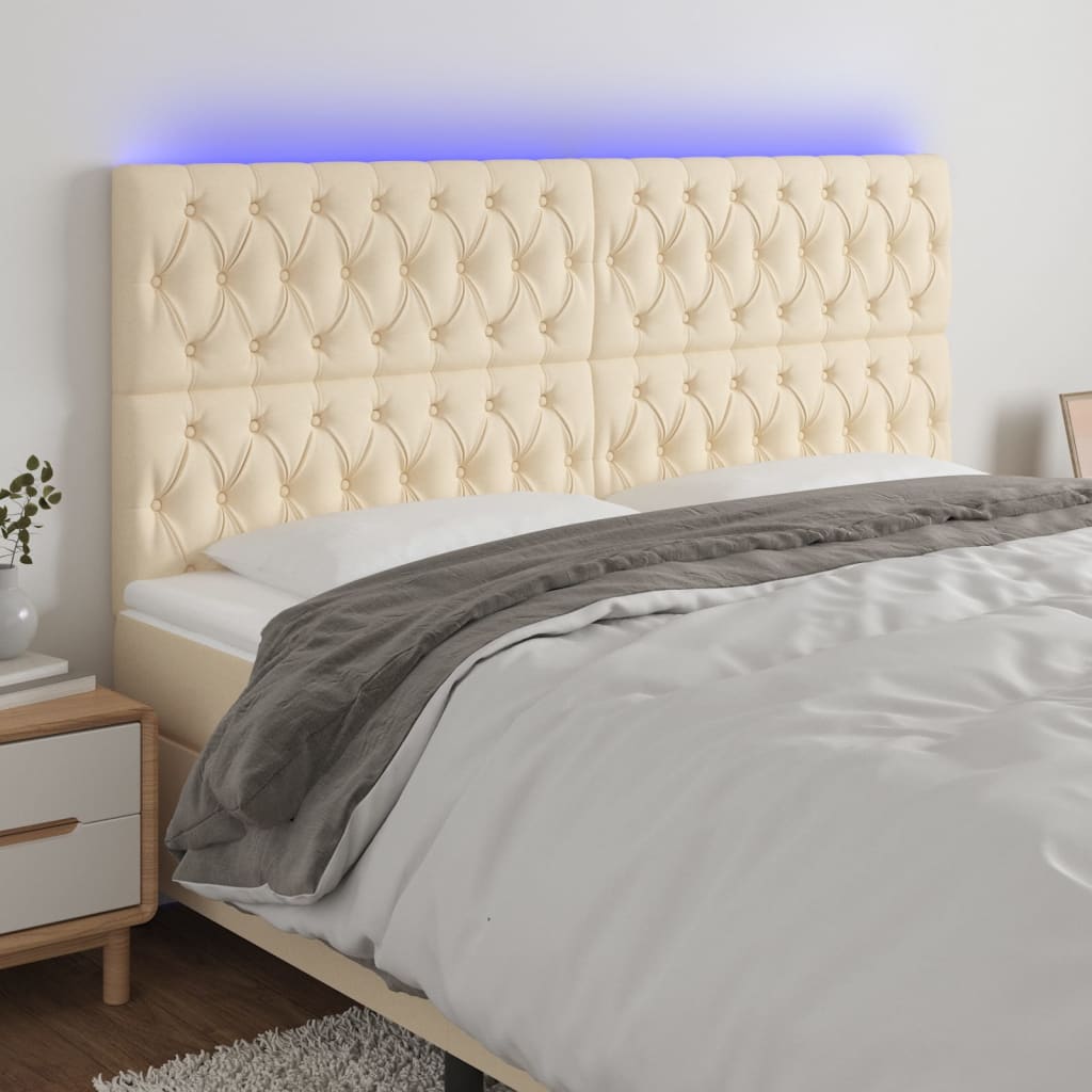 sengegavl med LED-lys 200x7x118/128 cm stof cremefarvet