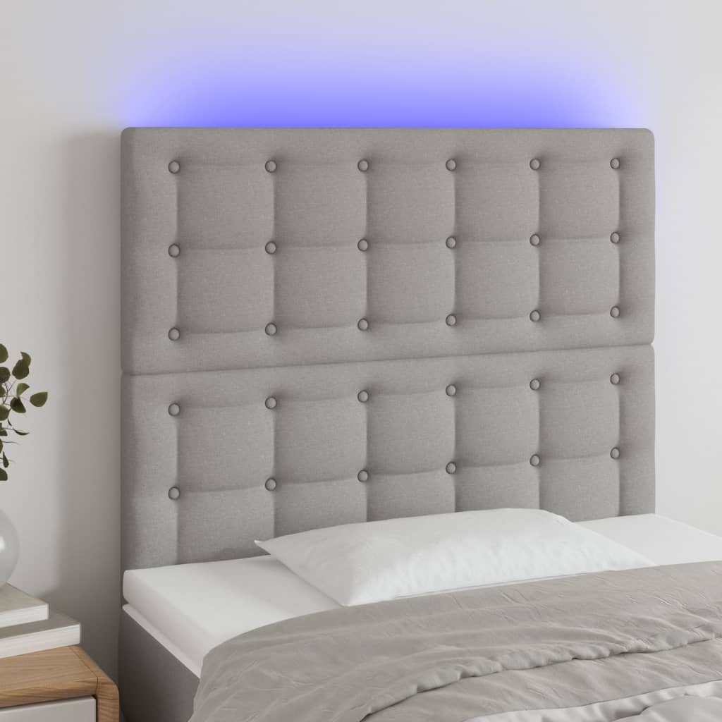 sengegavl med LED-lys 90x5x118/128 cm stof lysegrå