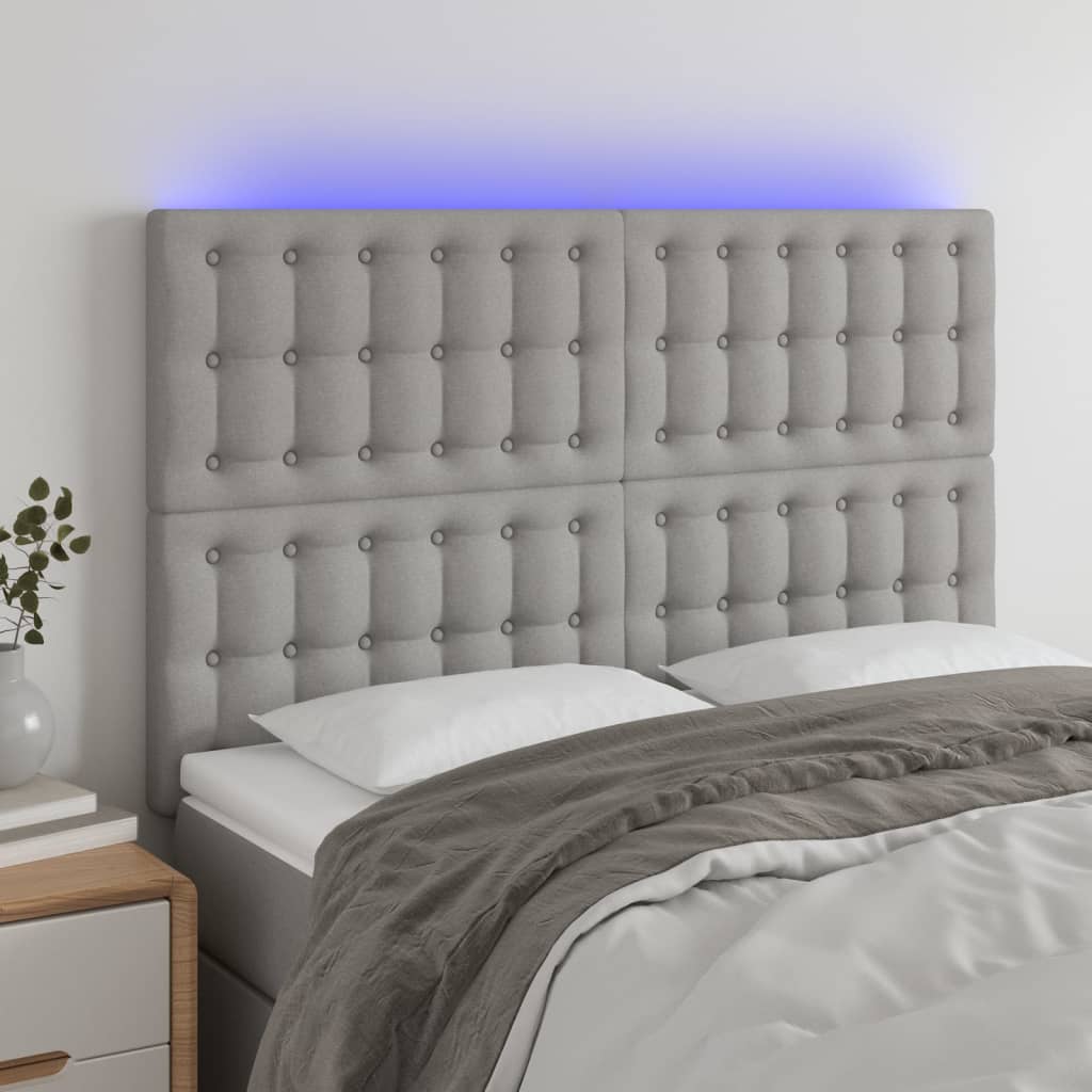 sengegavl med LED-lys 144x5x118/128 cm stof lysegrå