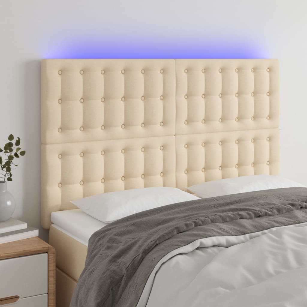 sengegavl med LED-lys 144x5x118/128 cm stof cremefarvet