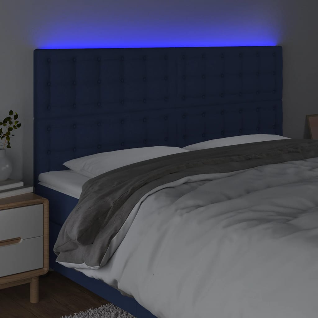sengegavl med LED-lys 180x5x118/128 cm stof blå