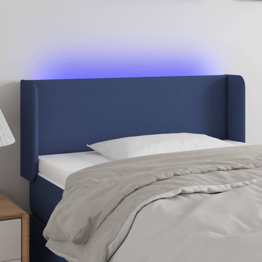 sengegavl med LED-lys 93x16x78/88 cm stof blå